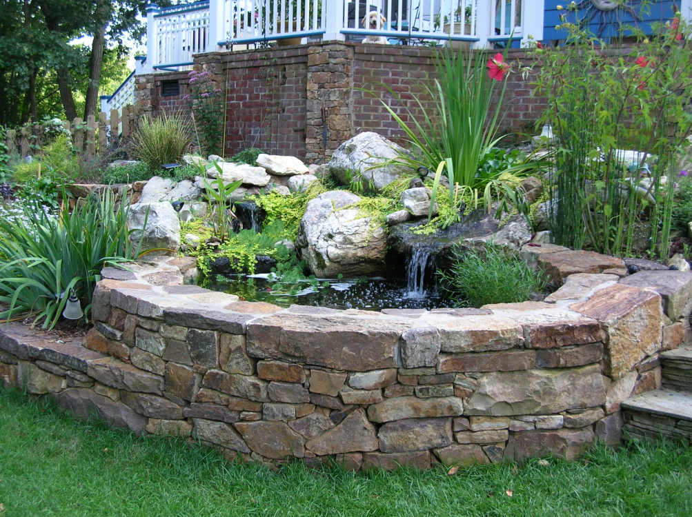 Stonework with water features for ponds in back yards water